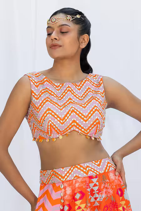 Orange kilim printed lehengas with chevron choli