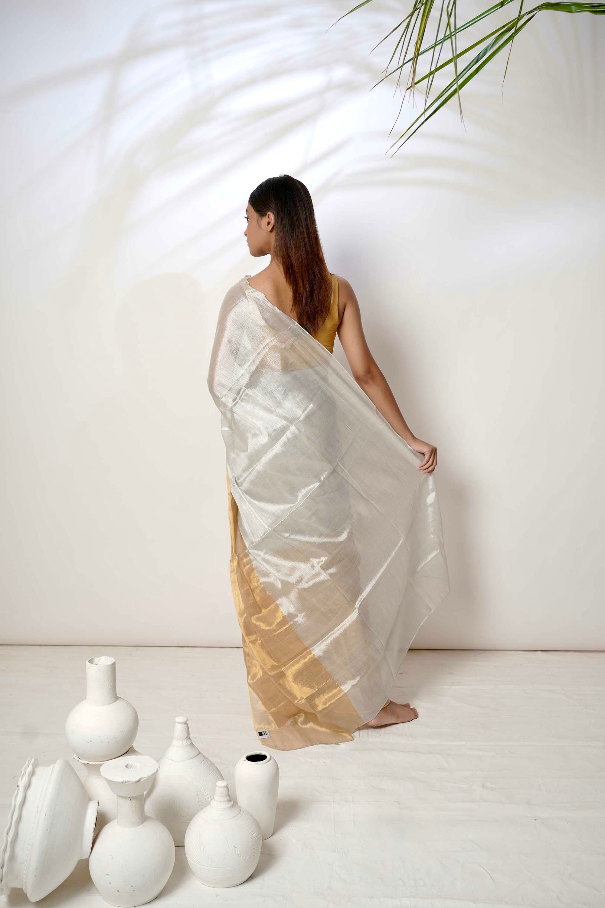 Aarna | Metallic white and gold tissue saree