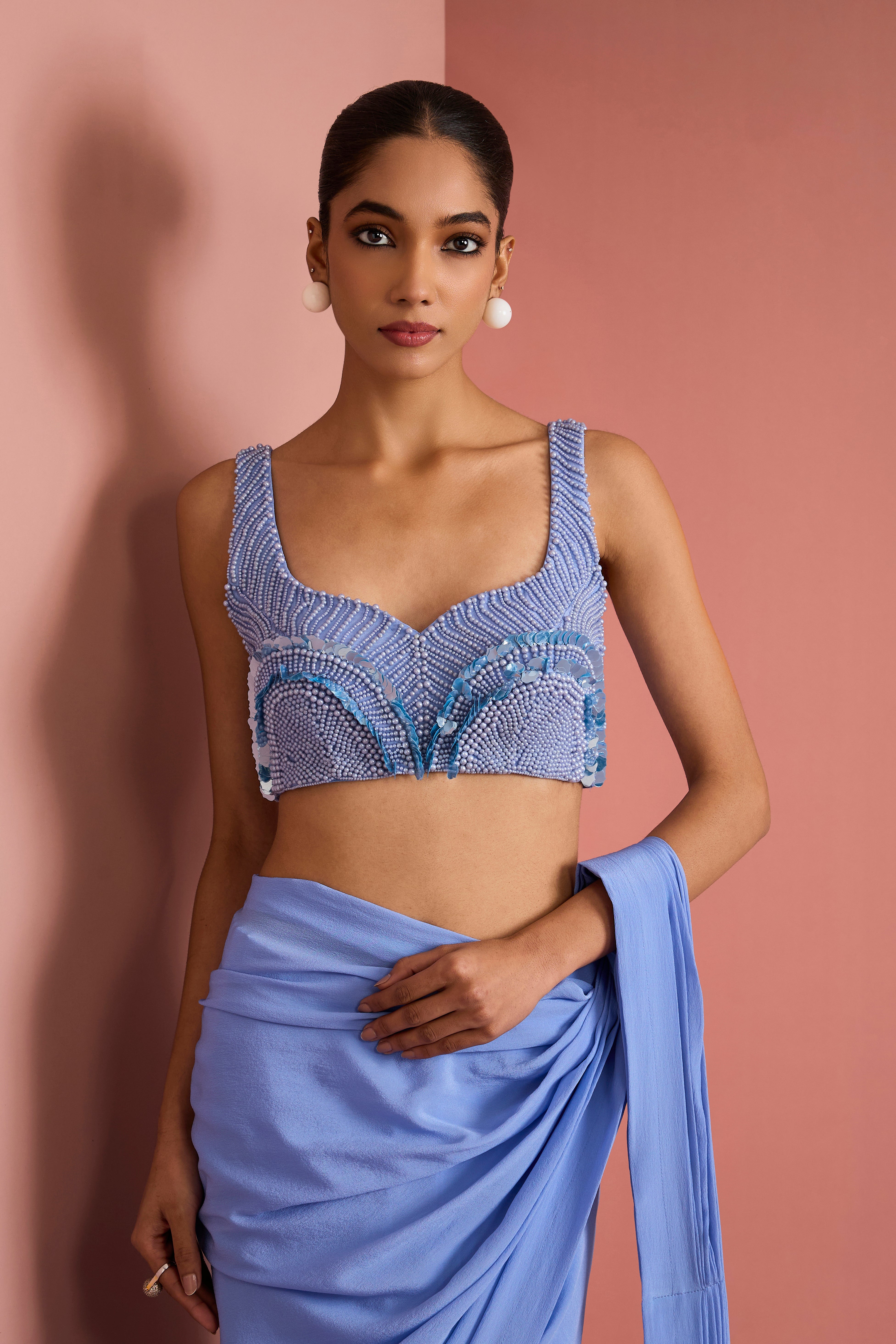 MEDIUM BLUE CREPE DRAPE SAREE WITH PEARL WORK BLOUSE .
