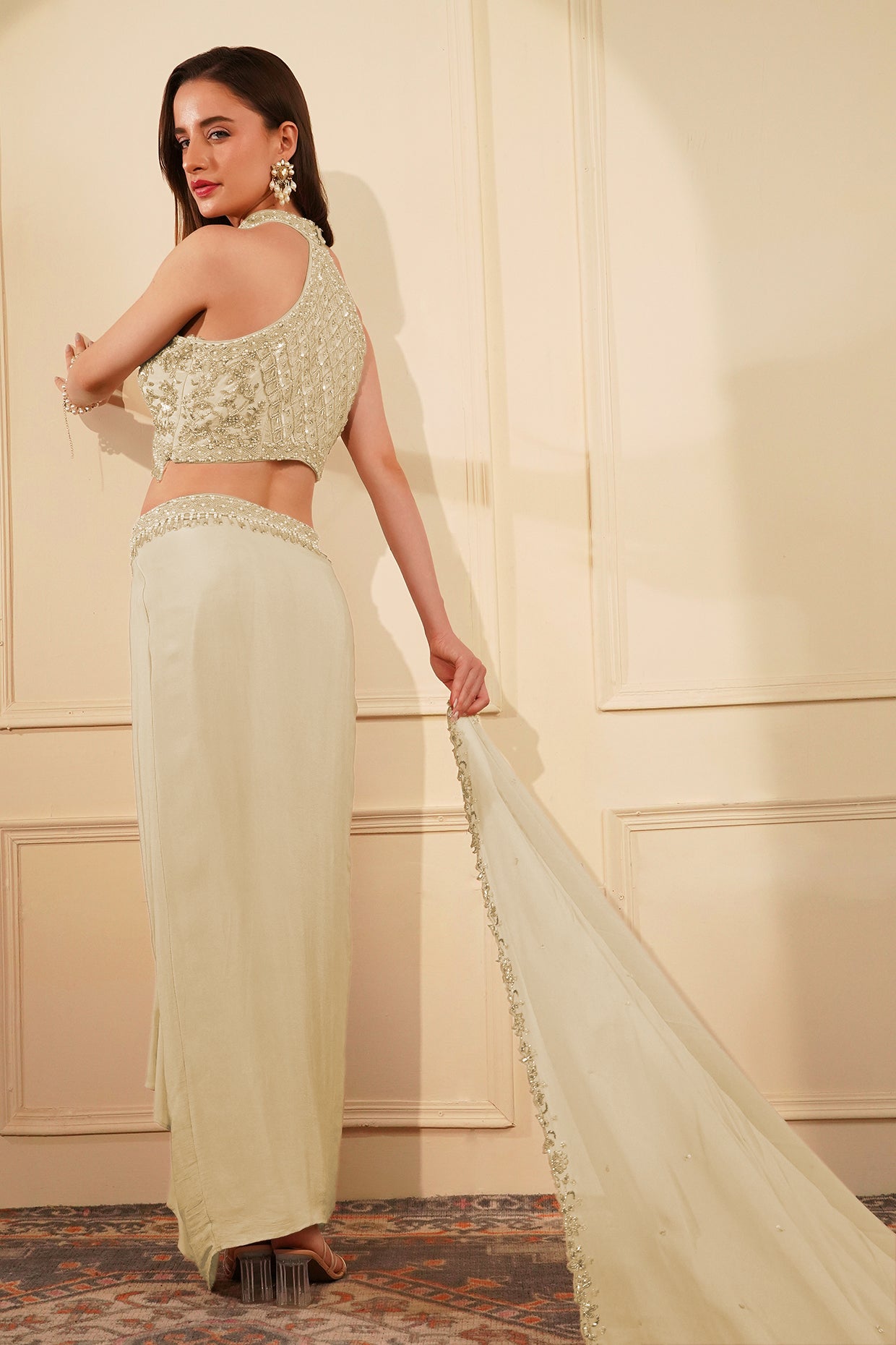 Dull Ivory Crepe Drape Skirt Set With Heavy Hand Embroidered Halter Blouse And Dupatta