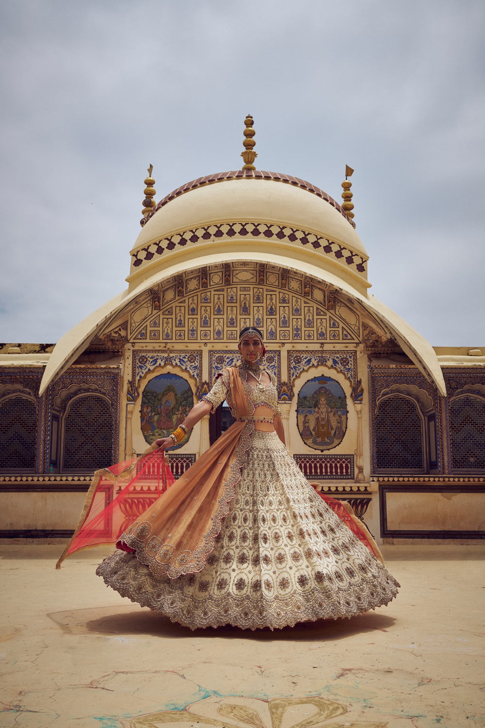 GOLD TISSUE LEHENGA CHOLI WITH A PEACH TISSUE DUPATTA