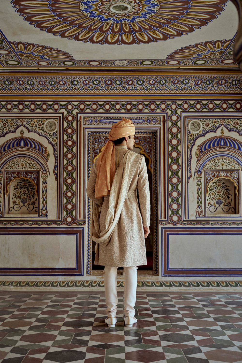 MUSHROOM RAW SILK SHERWANI WITH A COTTON SILK KURTA AND CHURIDAR AND OPTIONAL STOLE BELT AND WORKED JUTIS.
