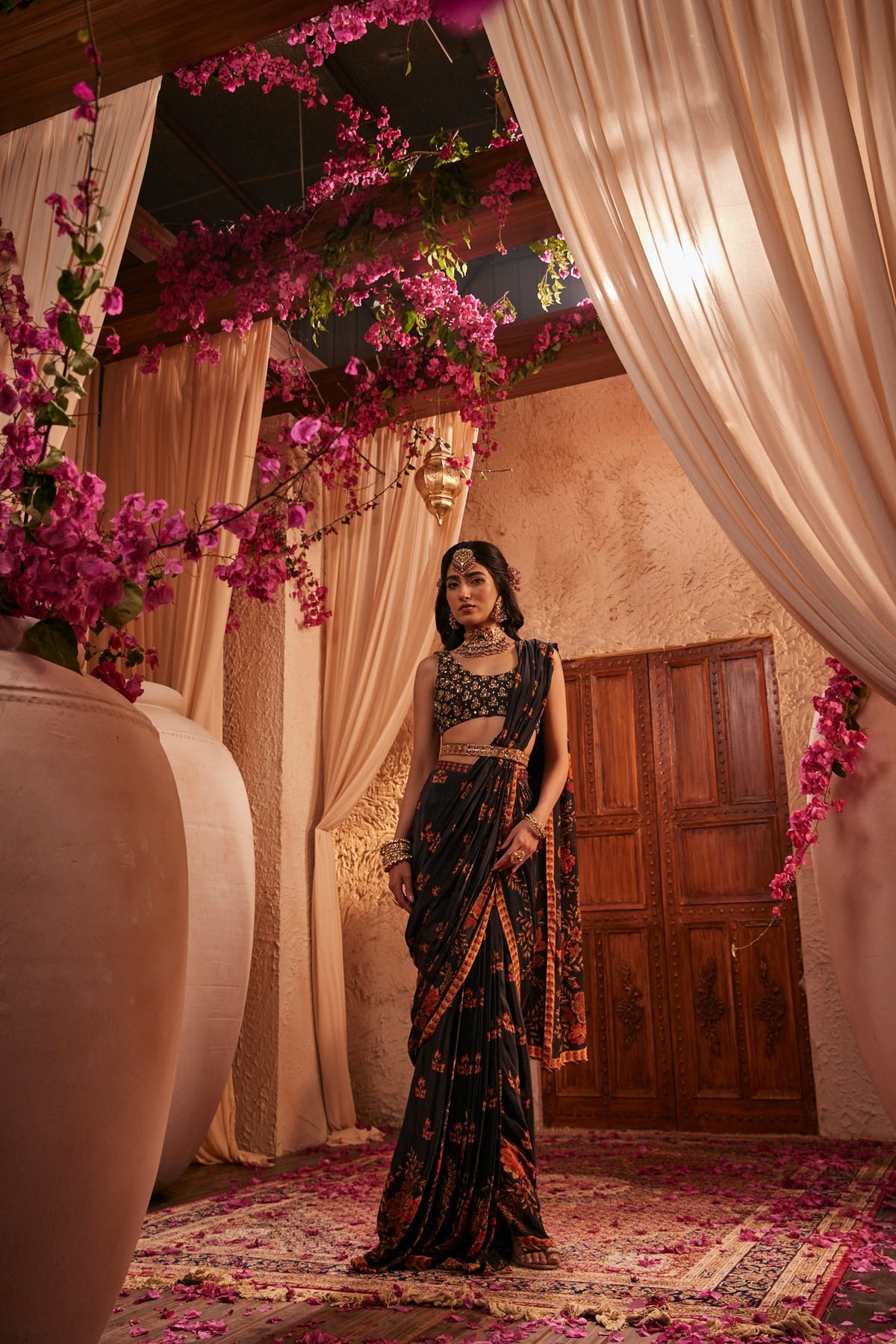 Black Saree Adorned Paired With An Intricately Embroidered Blouse