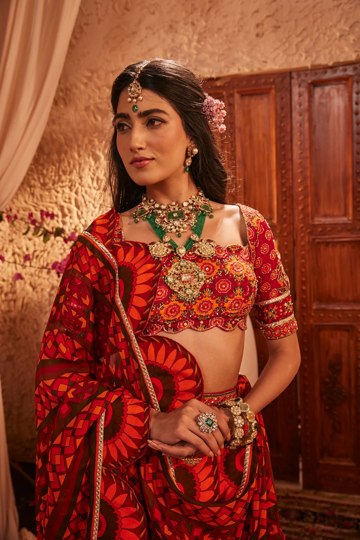 Red Lehenga Adorned With Intricate Floral And Geometric Prints