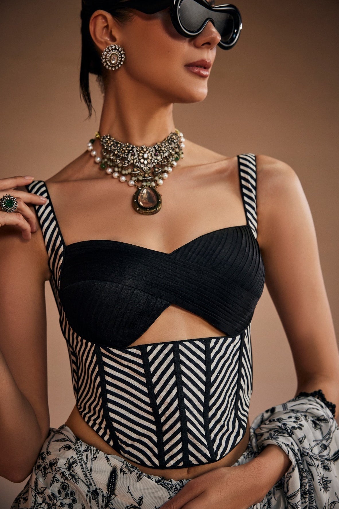 Contemporary printed saree paired with cut-out corset blouse.