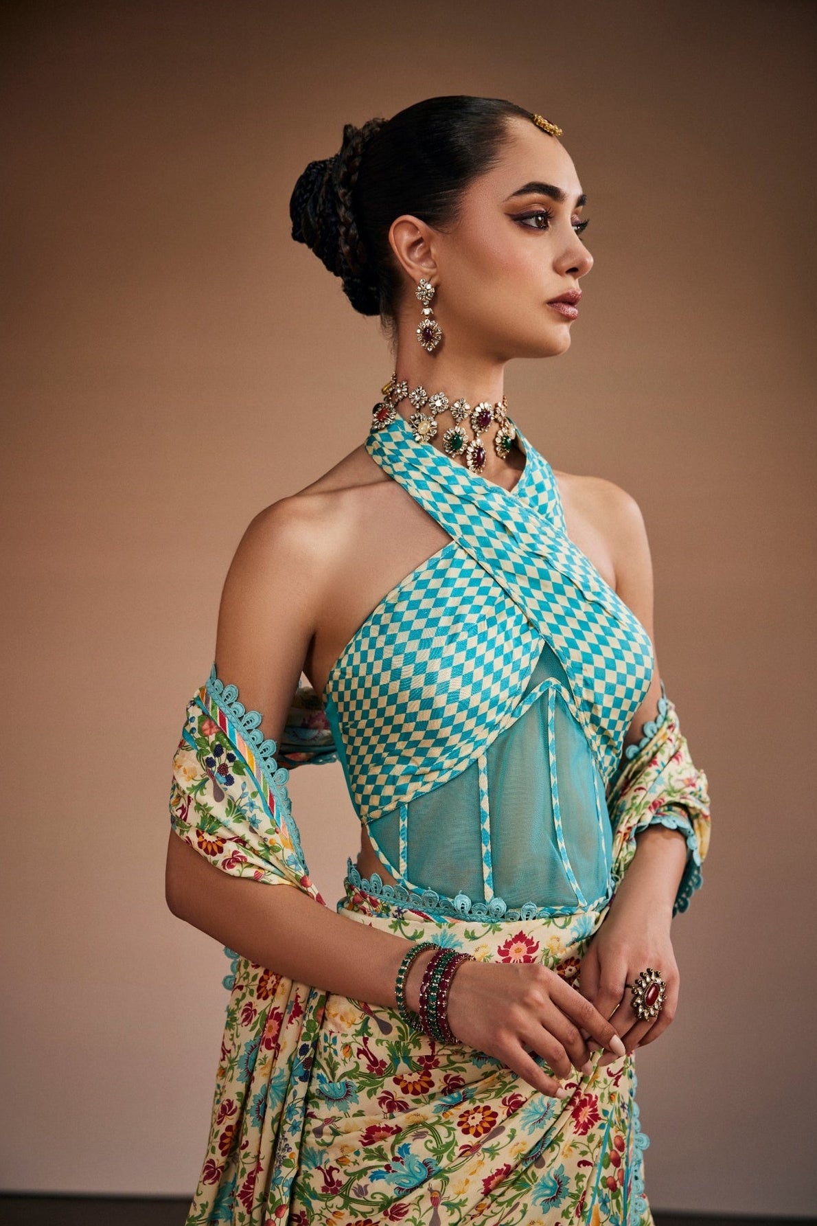 Floral printed saree with stylish corset blouse and border lace.
