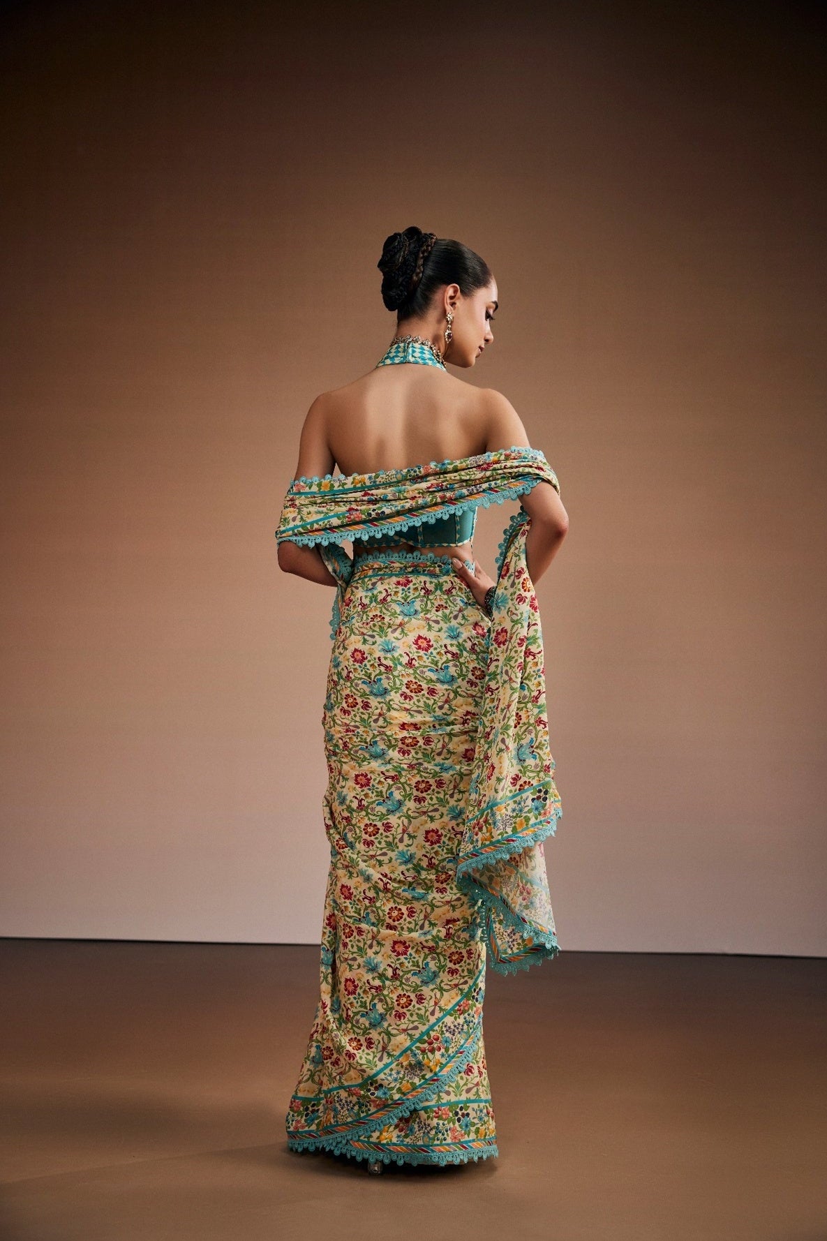 Floral printed saree with stylish corset blouse and border lace.