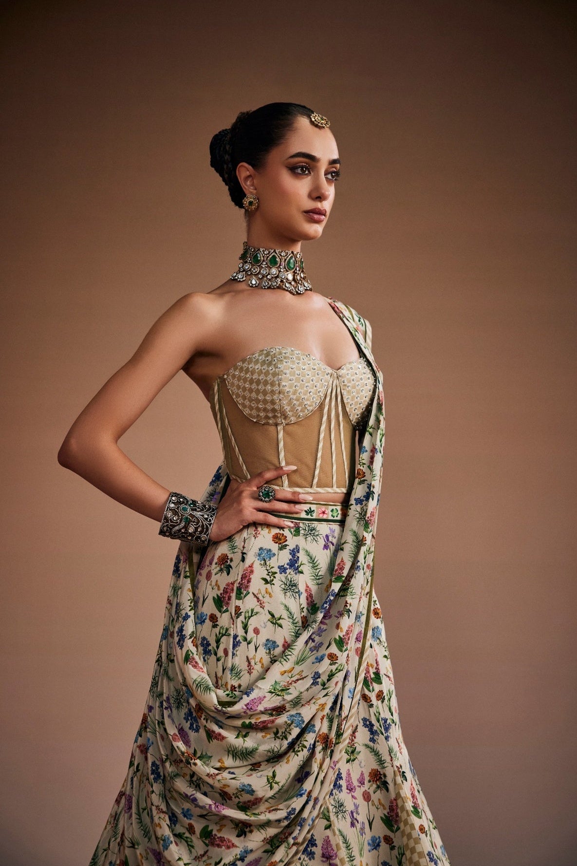 Beige lehenga paired with corset blouse and draped dupatta inspired with checks and floral print