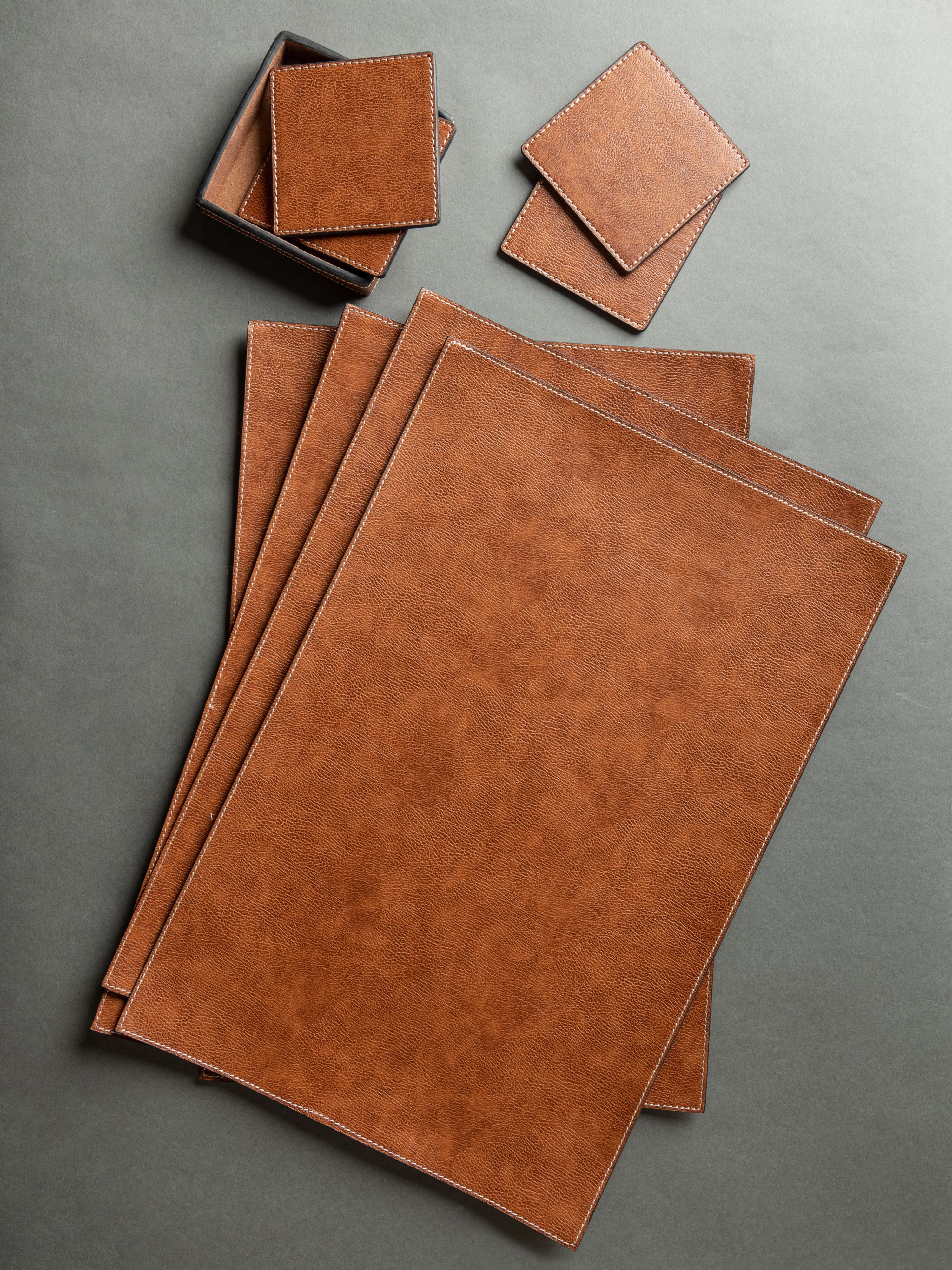 set of faux leather placemats and coasters - 4pc each/set