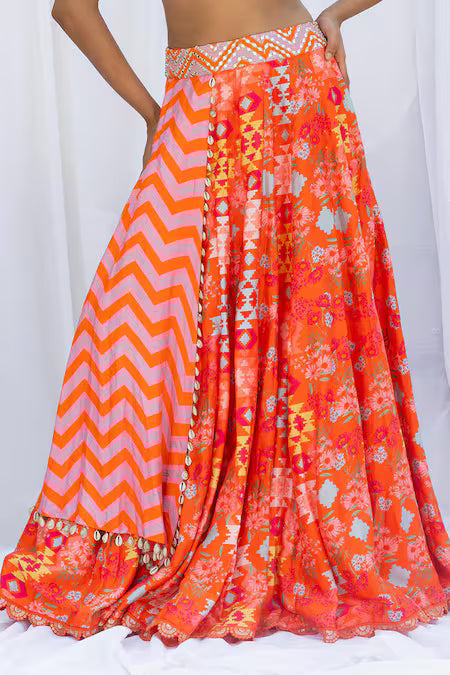 Orange kilim printed lehengas with chevron choli
