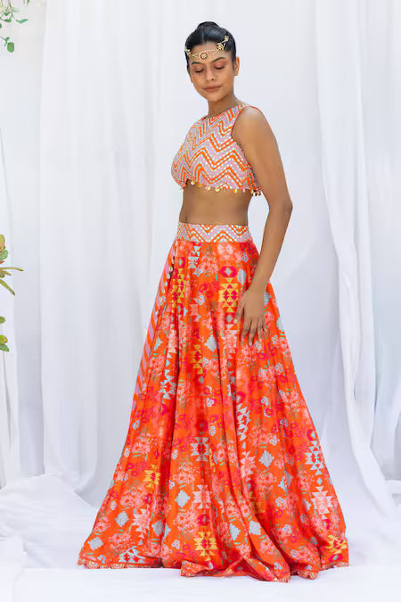 Orange kilim printed lehengas with chevron choli