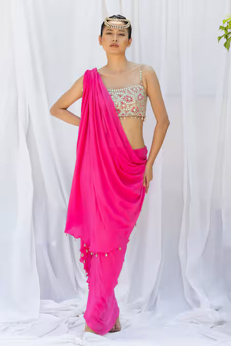 Fuchsia pink draped saree with embroidered choli