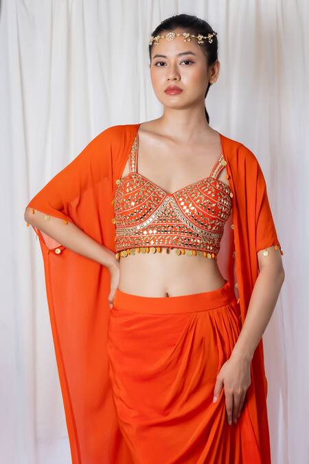 Orange draped saree with mirror work choli and cape