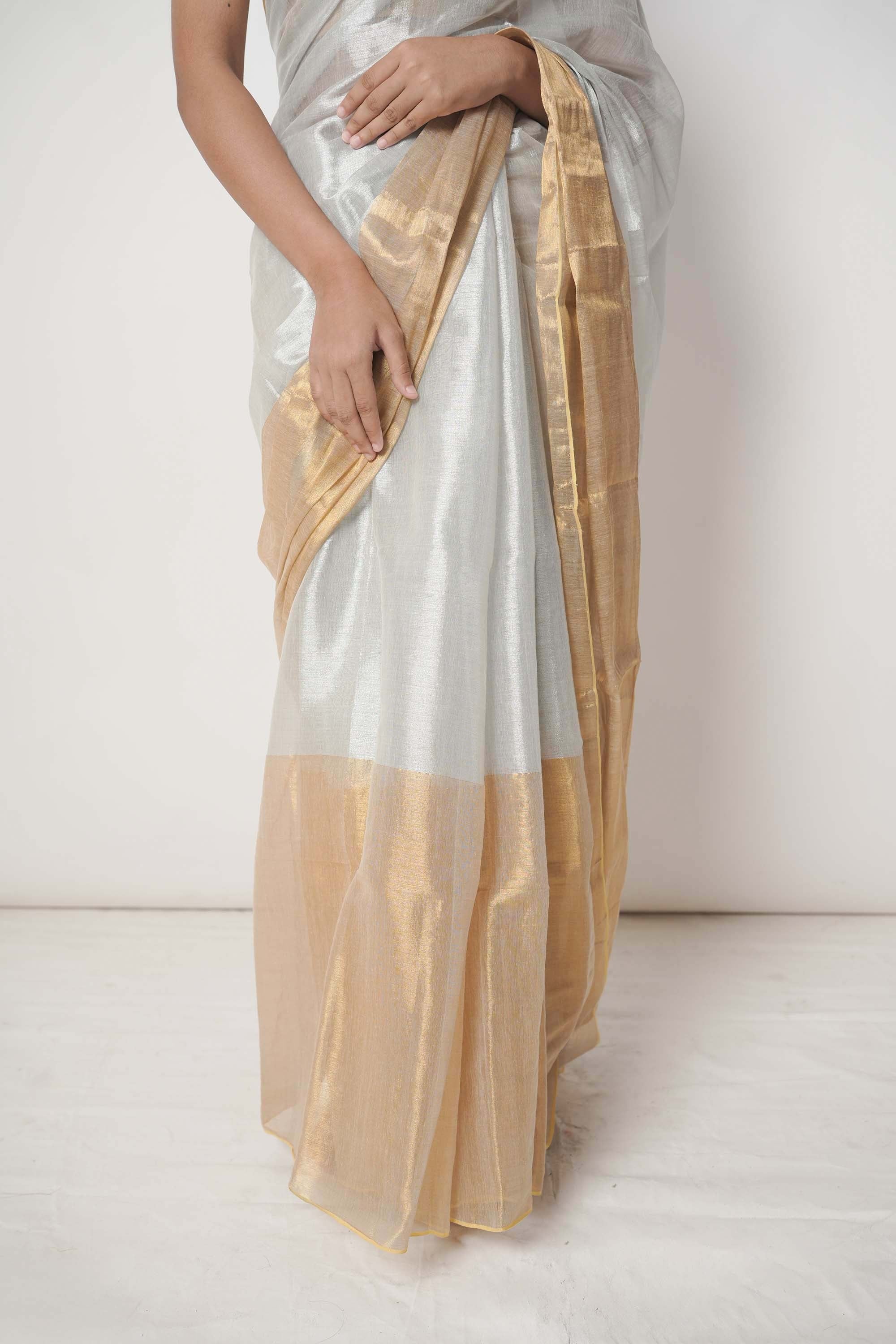 Aarna | Metallic white and gold tissue saree