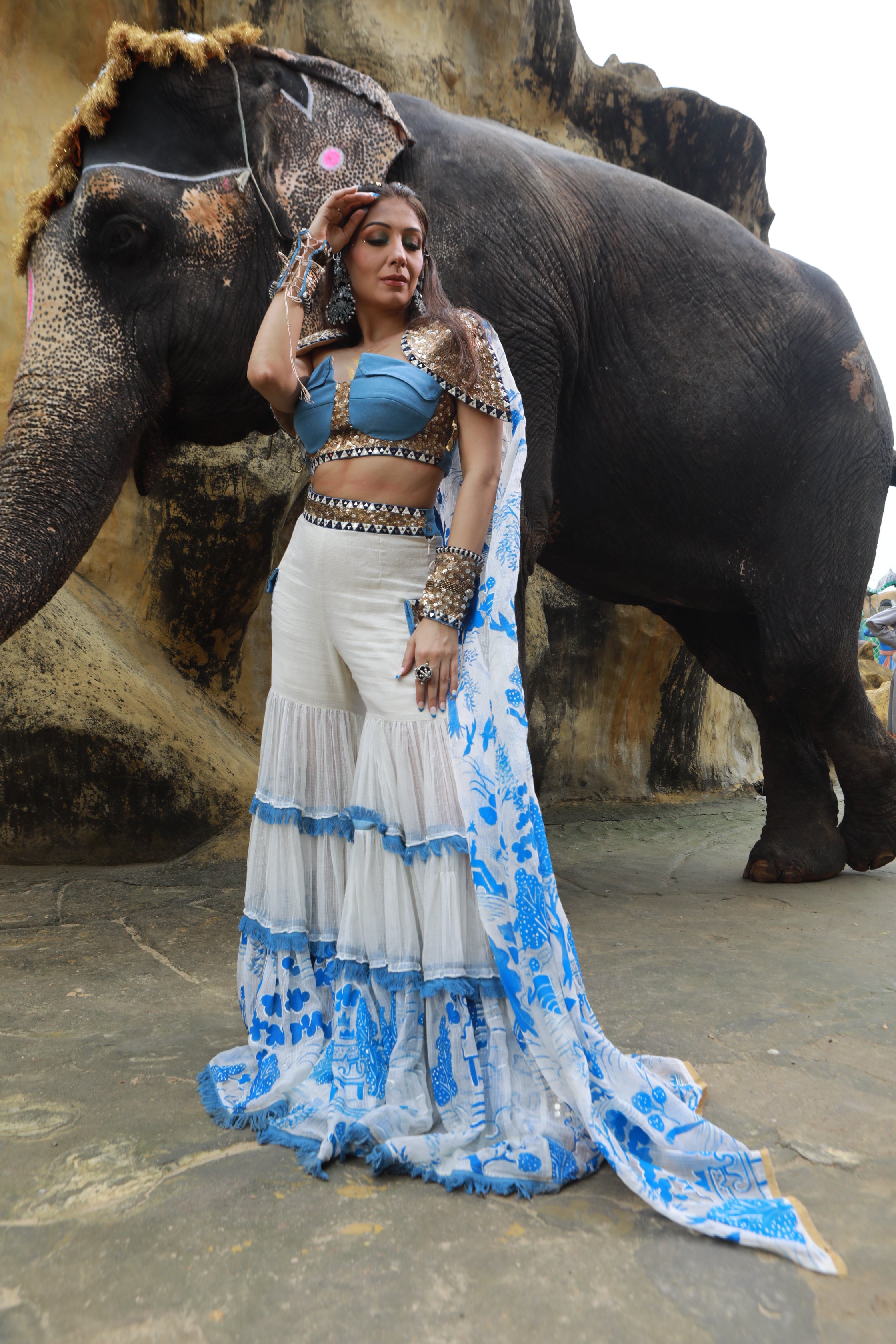 IVORY KOTA DORIA HAND PAINTED SHARARA WITH DENIM EMBELLISHED BUSTIER WITH IVORY HAND PAINTED EMBELLISHED  CAPE