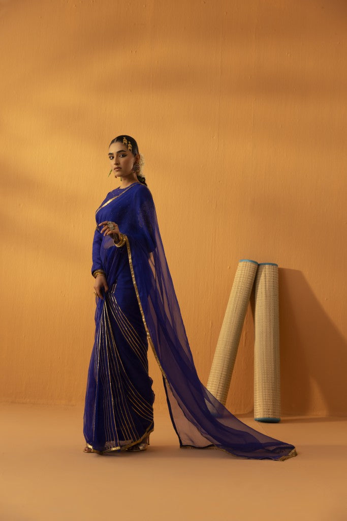 Neeltara magnetic blue embroidered saree set