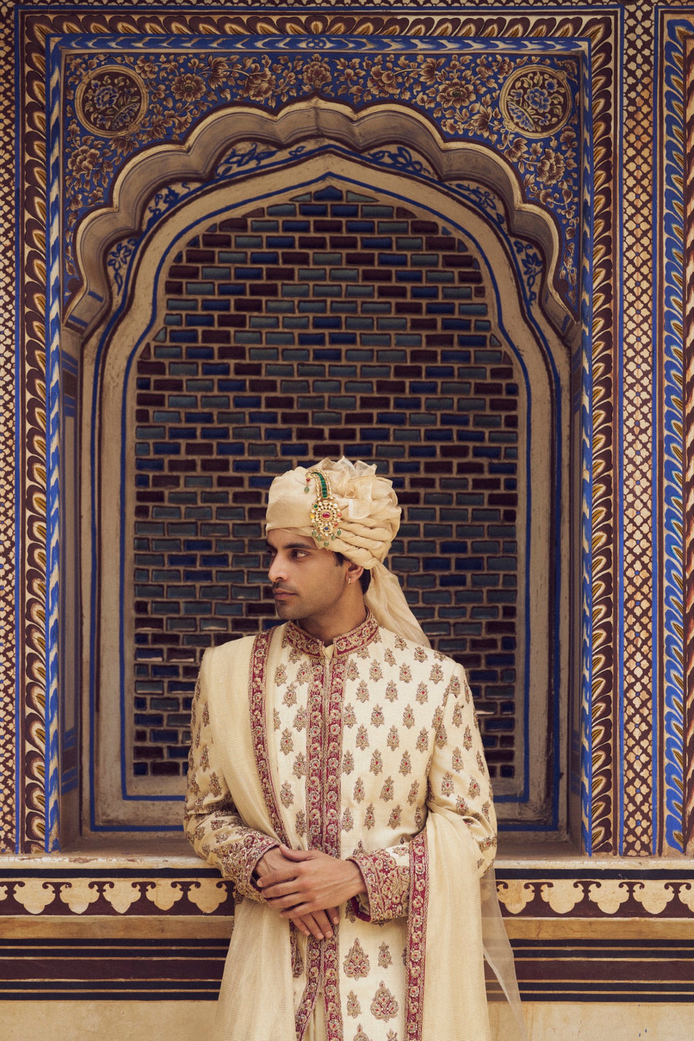 BEIGE RAW SILK SHERWANI WITH A COTTON SILK CHOGA AND CHURIDAR, WITH AN OPTIONAL STOLE AND JUTIS