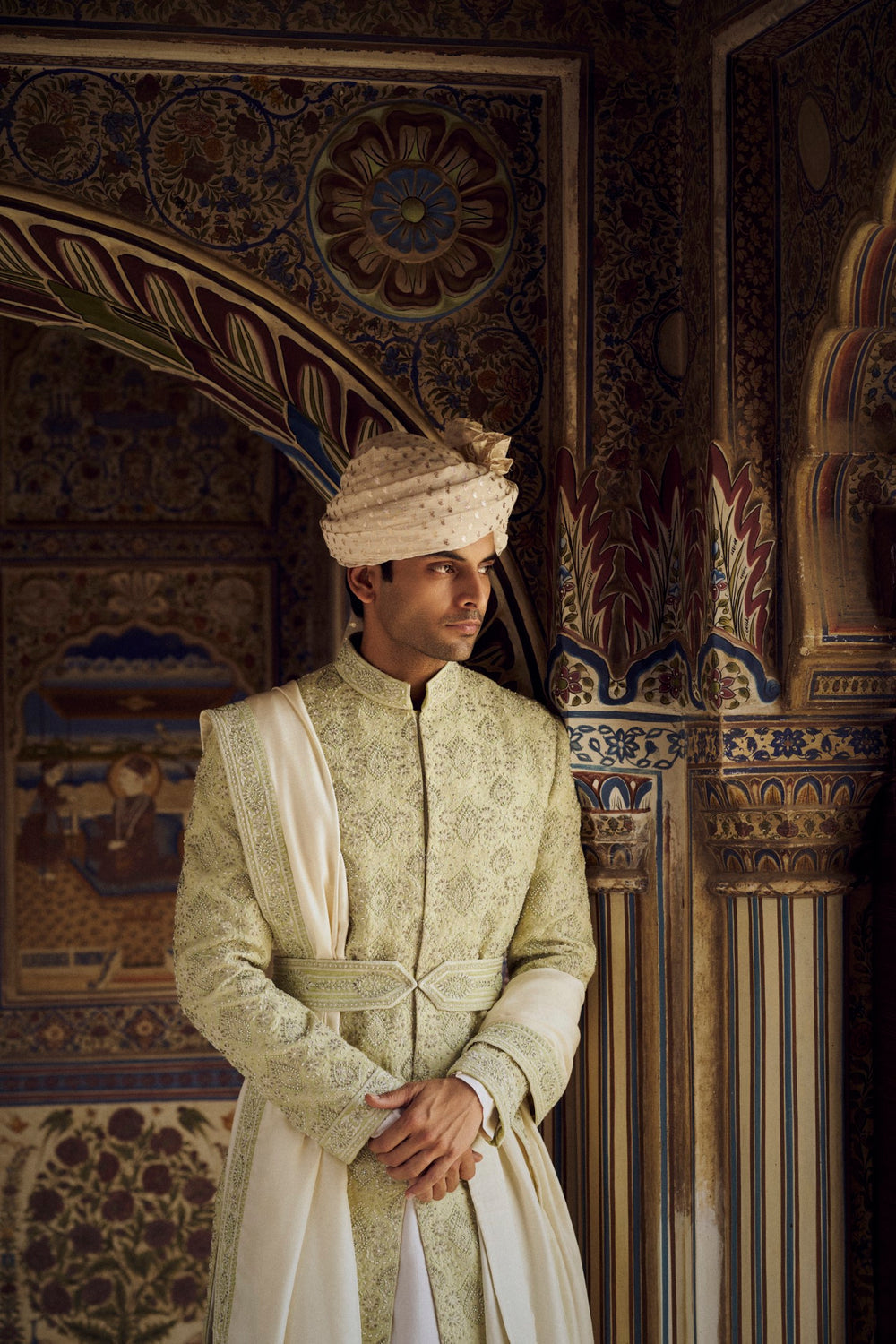 MINT GREEN RAW SILK SHERWANI WITH IVORY KURTA AND TROUSER WITH OPTIONAL WORKED STOLE BELT AND JUTIS.