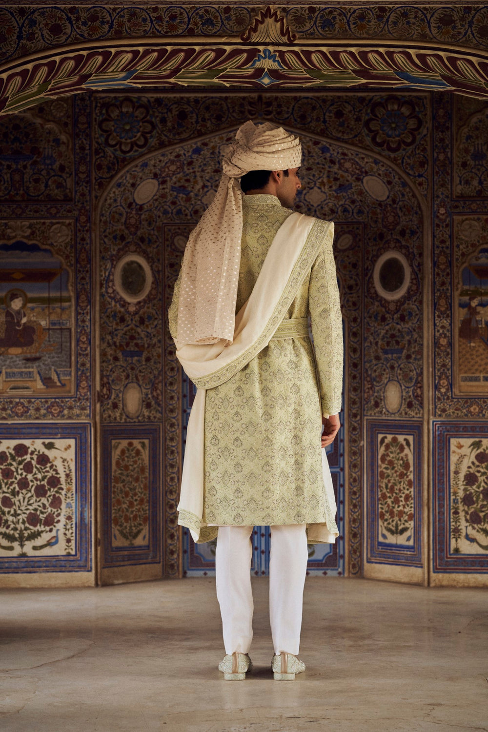 MINT GREEN RAW SILK SHERWANI WITH IVORY KURTA AND TROUSER WITH OPTIONAL WORKED STOLE BELT AND JUTIS.