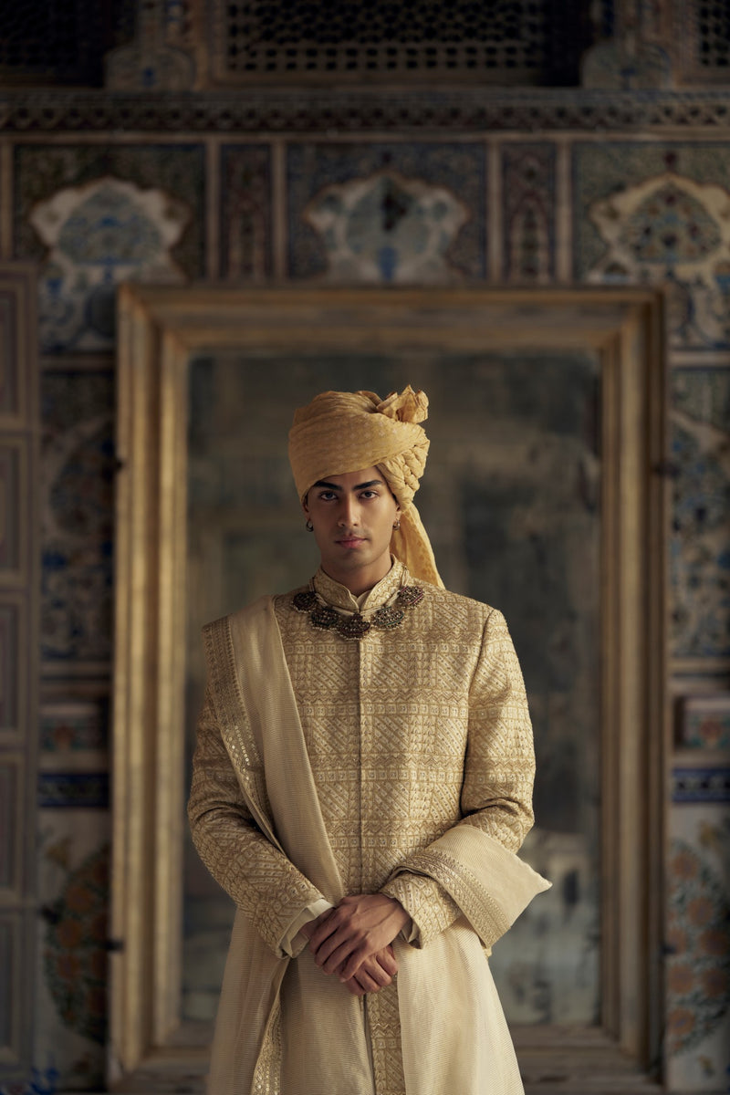 GOLD SHERWANI SET WITH CHOGA AND CHURIDAR WHICH COMES WITH AN OPTIONAL WORKED STOLE AND JUTIS