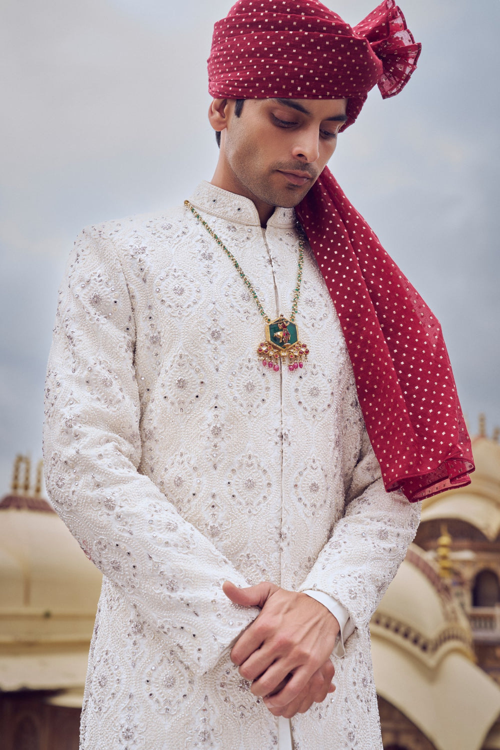 IVORY RAW SILK SHERWANI WITH A COTTON SILK CHOGA AND CHURIDAR AND OPTIONAL STOLE BELT AND WORKED JUTI