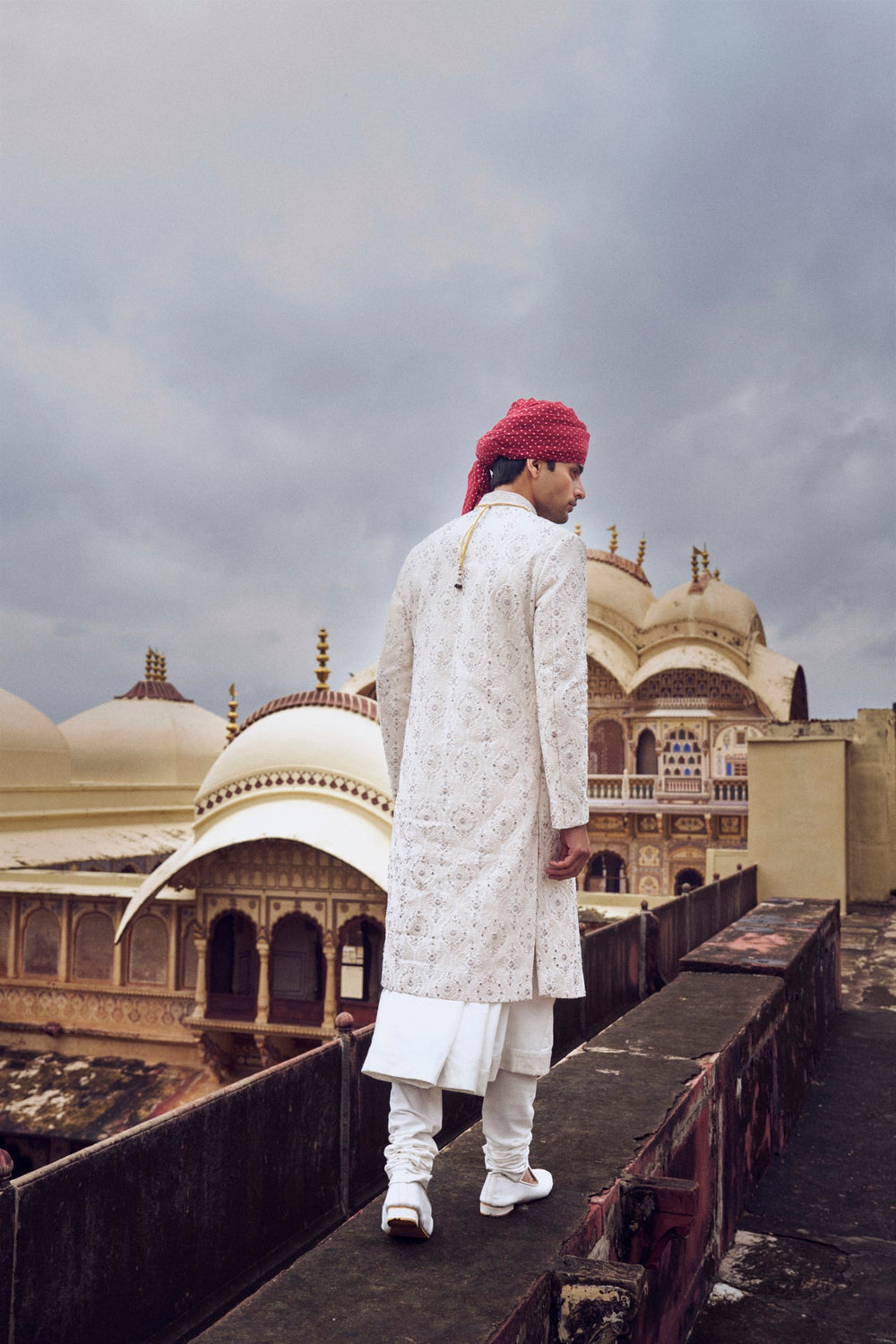 IVORY RAW SILK SHERWANI WITH A COTTON SILK CHOGA AND CHURIDAR AND OPTIONAL STOLE BELT AND WORKED JUTI