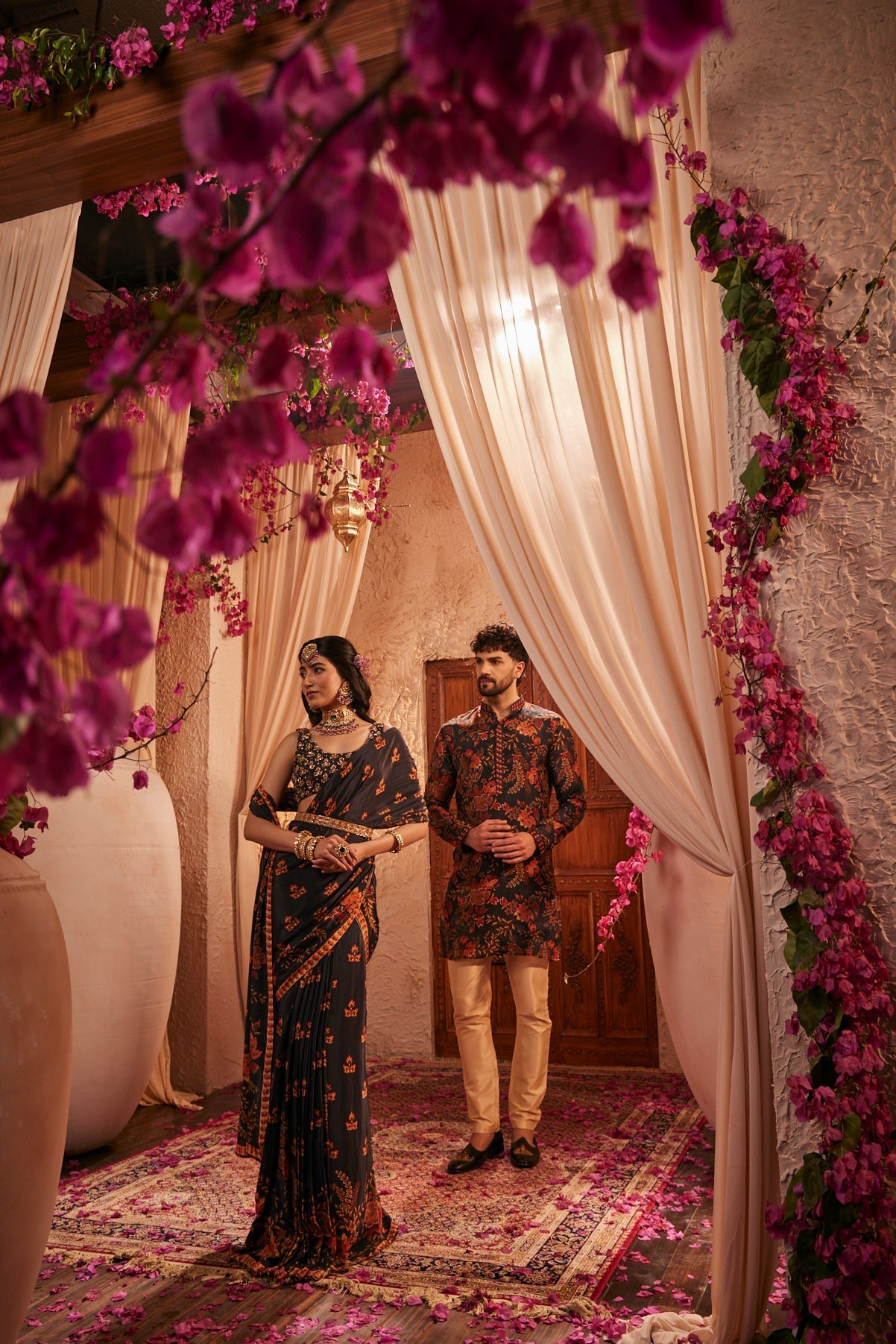 Black Saree Adorned Paired With An Intricately Embroidered Blouse