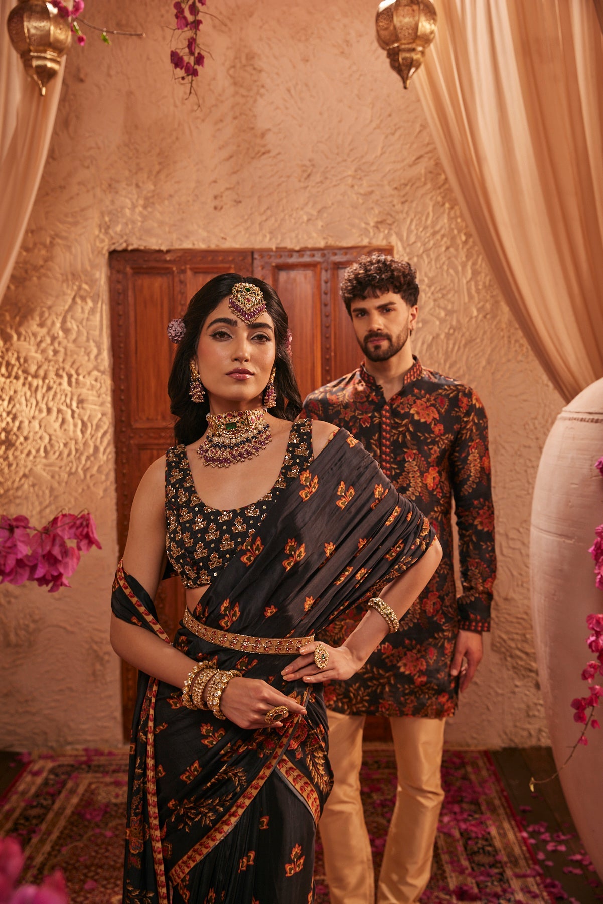 Black Saree Adorned Paired With An Intricately Embroidered Blouse
