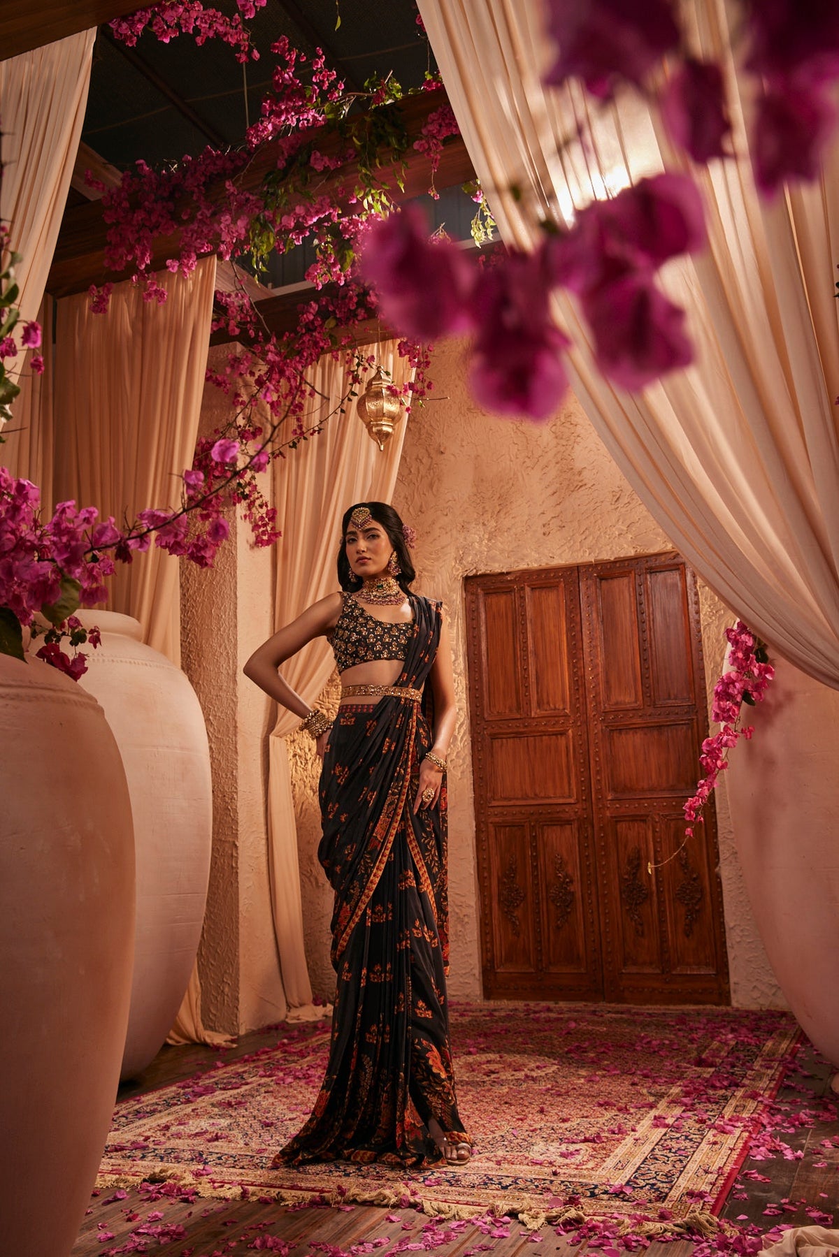 Black Saree Adorned Paired With An Intricately Embroidered Blouse
