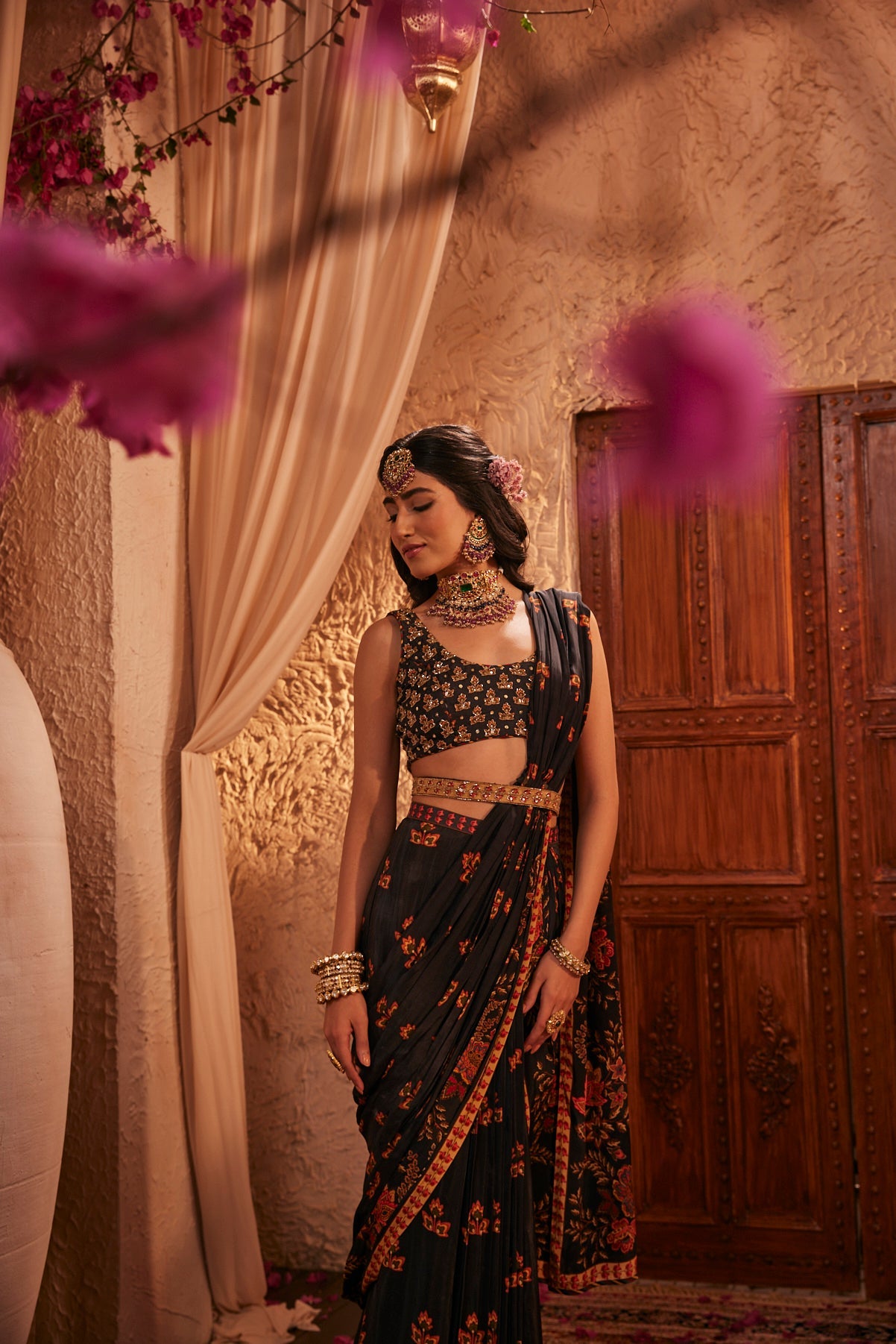 Black Saree Adorned Paired With An Intricately Embroidered Blouse