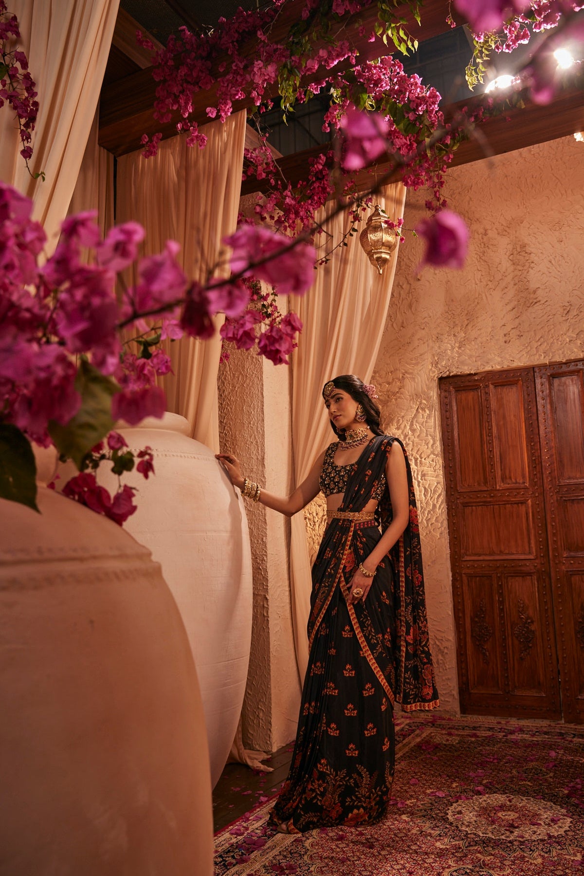 Black Saree Adorned Paired With An Intricately Embroidered Blouse