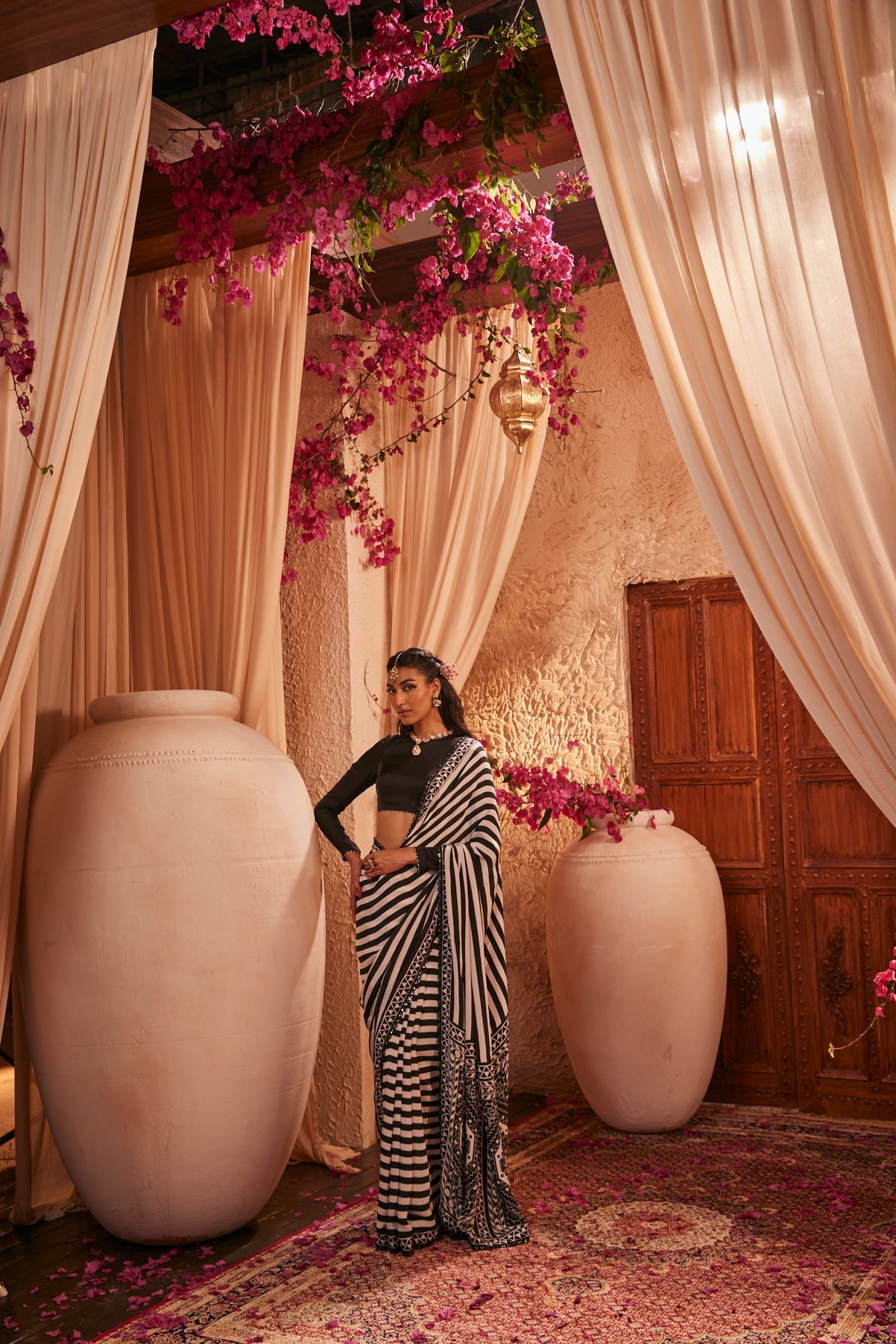 Black And White Saree With Intricate Motifs Paired With Black Full-Sleeved Blouse