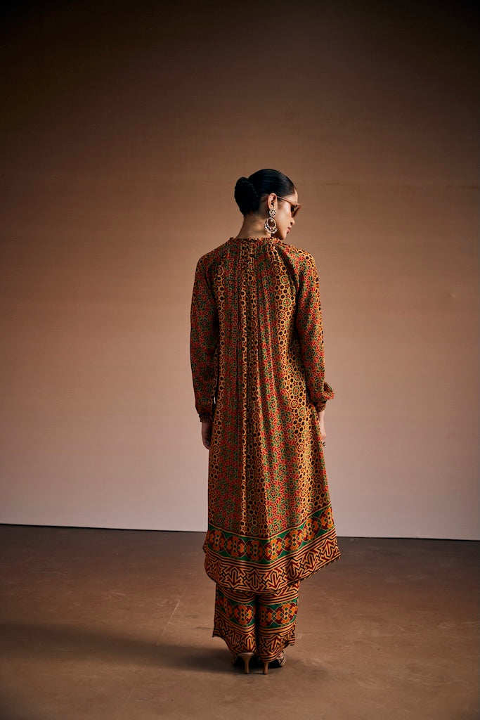 Vermilion red & rust orange suit