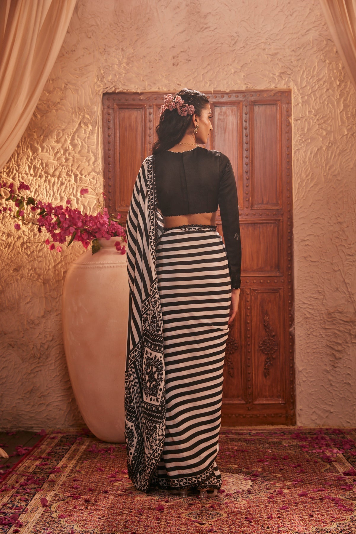 Black And White Saree With Intricate Motifs Paired With Black Full-Sleeved Blouse