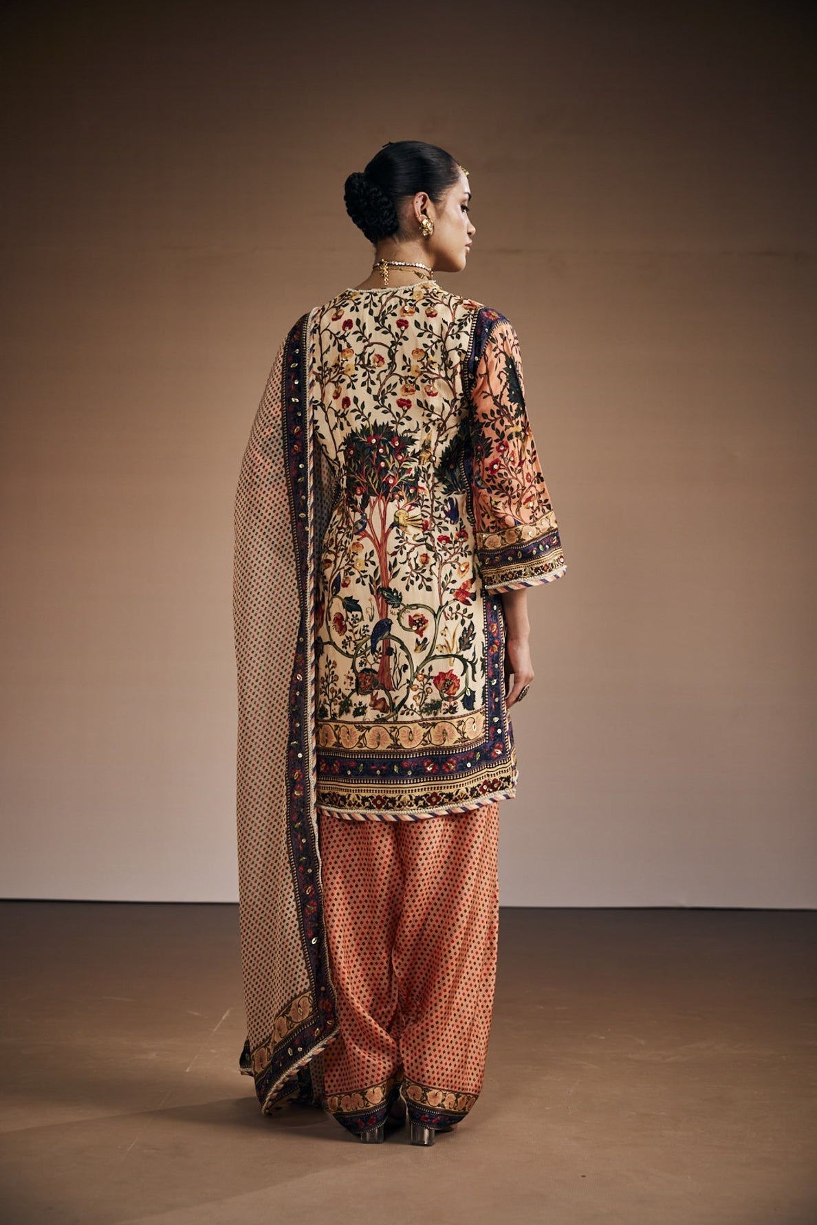 Ivory kurta set inspired with tree of life print.