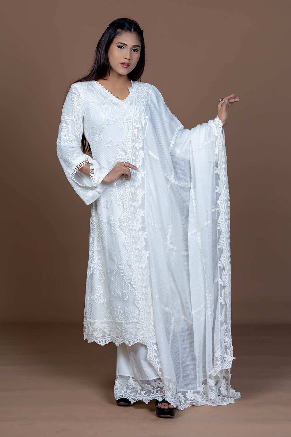 Lace embellished white kurta set paired with Kota doria dupatta