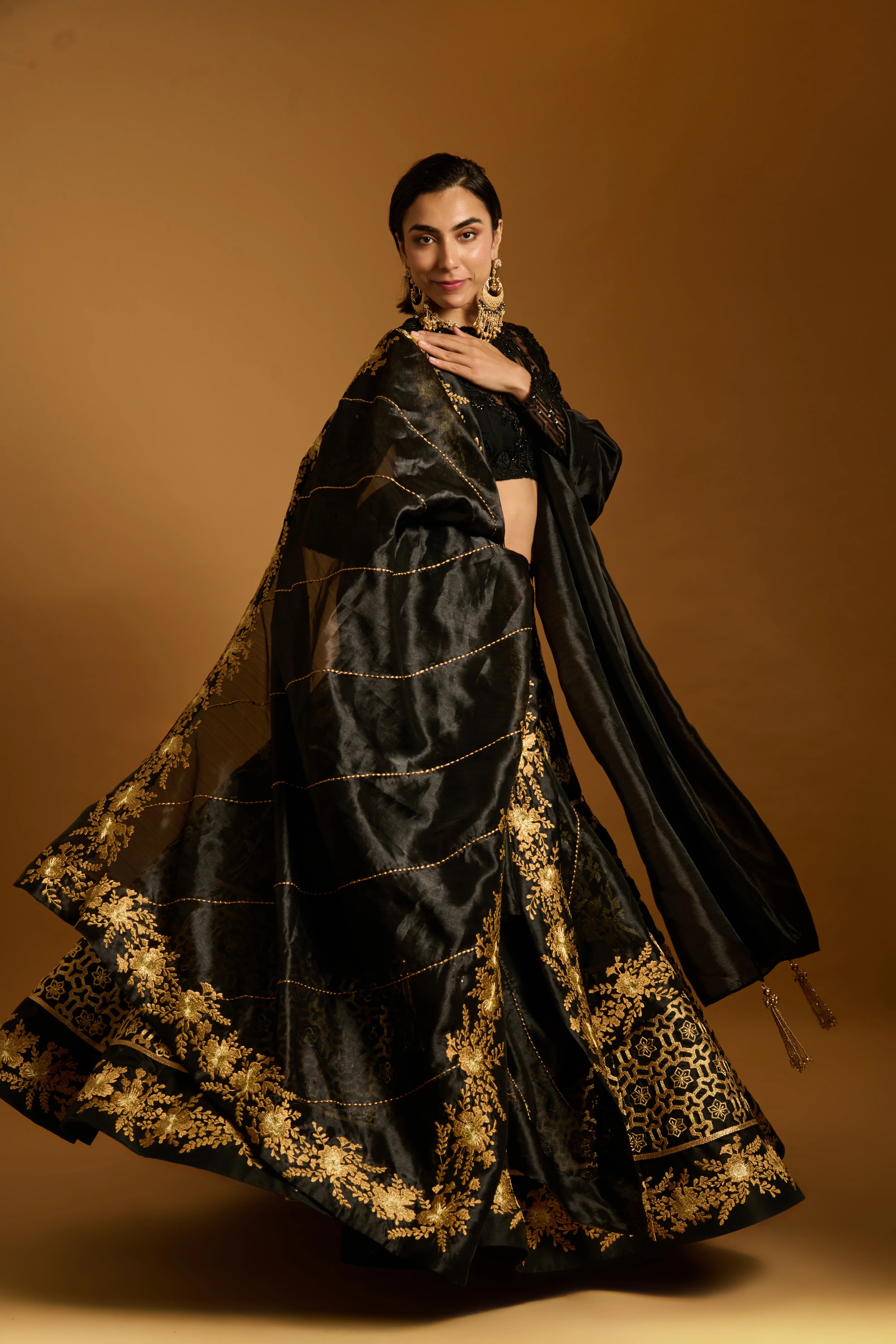 Trifecta black gold zari lehenga