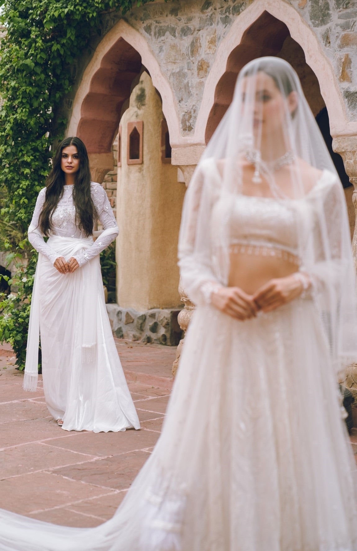 White embroidered draped evening gown